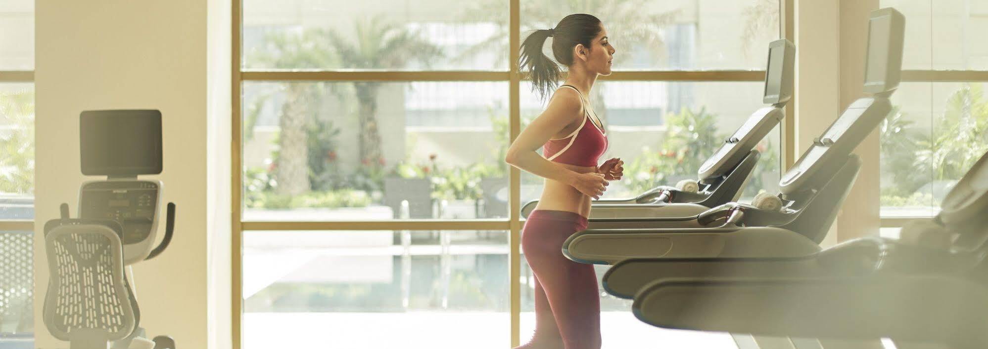 Taj Swarna, Amritsar Hotel Exterior photo A woman exercising on a treadmill